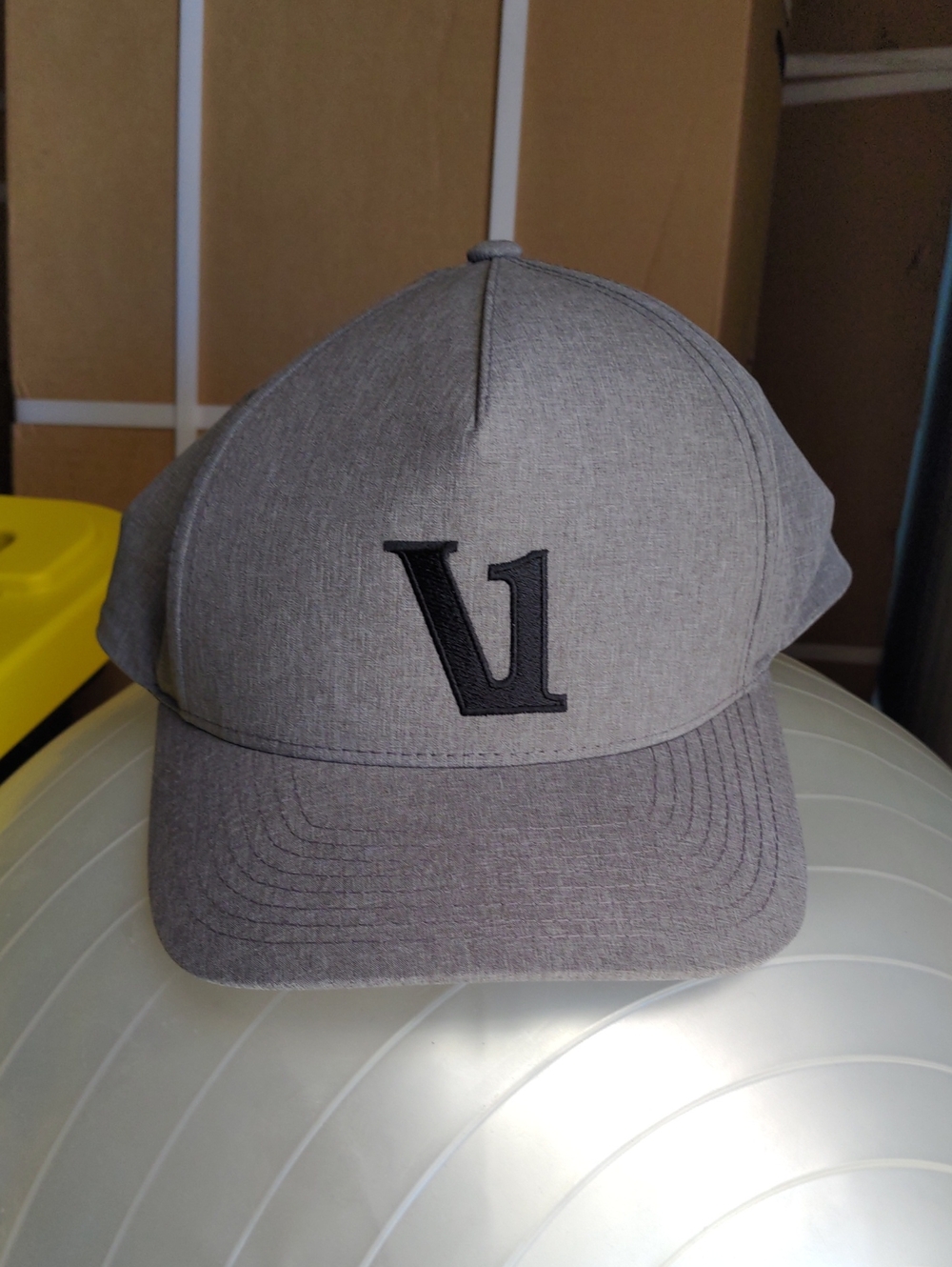 Vuori Heather Gray Baseball Cap with Black 'V1' Logo